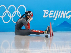 Canada’s Alyson Charles reacts after crashing during her 500M short track speed skating quarterfinal at the Beijing 2022 Winter Olympics on Monday, February 7, 2022.