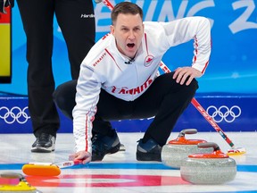 Team Canada skip Brad Gushue calls out in the team’s first game in men’s curling against Denmark at the Beijing 2022 Winter Olympics on Wednesday, February 9, 2022.