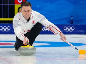 Team Canada skip Brad Gushue throws last rock in the team’s first game in men’s curling against Denmark at the Beijing 2022 Winter Olympics on Wednesday, February 9, 2022