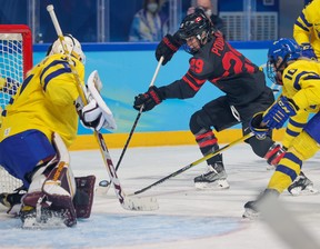 Team Canada's Marie-Philip Poulin shoots Swedish goalkeeper Emma Söderberg in a quarter-final action in women's hockey at the Winter Olympics in Beijing 2022 on Friday 11 February 2022.