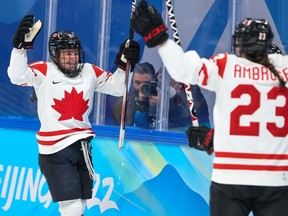 Team Canada celebrates their goal against Switzerland in the semifinals at the Beijing 2022 Olympic Winter Games, Monday February 14, 2022. Canada won 10-2 and is playing for a gold medal.
