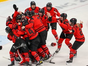 Team Canada celebrates winning the gold medal in women’s hockey downing the USA 3-2 at the Beijing 2022 Winter Olympics on Thursday, February 17, 2022.