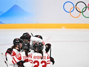 Canada's players celebrate their seventh goal in the women's semi-final of the Beijing 2022 Olympic Winter Games playoffs.