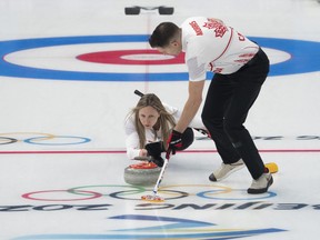 Canadian curlers Rachel Homan and John Morris practice at the Ice Cube Wednesday, February 2, 2022 at the 2022 Winter Olympics  in Beijing.