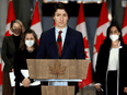 Prime Minister Justin Trudeau with Foreign Affairs Minister Mélanie Joly, Deputy Prime Minister Chrystia Freeland and National Defence Minister Anita Anand at a news conference about the situation in Ukraine, February 24, 2022 in Ottawa.