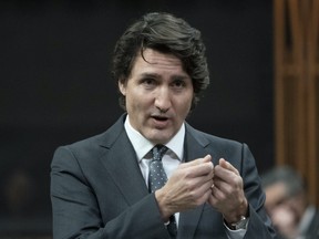 Prime Minister Justin Trudeau rises during Question Period, Tuesday, February 15, 2022 in Ottawa.  THE CANADIAN PRESS/Adrian Wyld