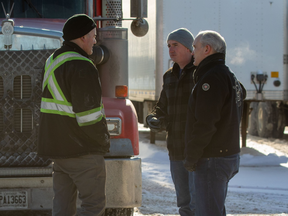 In this photo posted to his Twitter account, Erin O'Toole meets with Freedom Convoy truckers on their way to Ottawa.