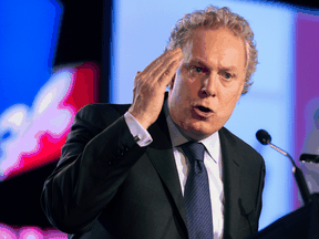 Jean Charest in 2012. During his time as Quebec premier, Charest generated animosity among some federal Conservatives that continues to this day.