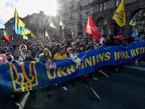 People march in Kyiv, Ukraine, on Saturday, Feb. 12, 2022, to demonstrate unity and resistance against a Russian invasion.