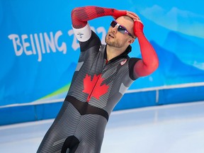 Canada’s Laurent Dubreuil reacts to his time after he missed out on a medal by a few hundredths of a second in the men’s 500M long track speed skating at the Beijing 2022 Winter Olympics.