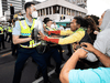 Police and protesters clash Tuesday in Wellington as police tightened a cordon around a convoy camped outside Parliament for two weeks.