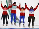 Bronze medalists Alexandria Loutitt, Matthew Soukup, Abigail Strate and Mackenzie Boyd-Clowes celebrate on the podium.