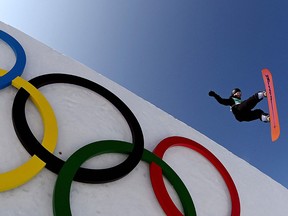 China's Yiming Su competes in the snowboard men's big air final run during the Beijing 2022 Winter Olympic Games at the Big Air Shougang.