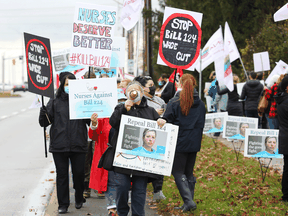 An Ontario Nurses’ Association protest against Bill 124 in front of the office of Health Minister Christine Elliot in Ottawa, November 12, 2021. The fate of Bill 124, which limits annual salary increases, is one of the issues up for discussion at the meeting with the association and Premier Doug Ford on Thursday.