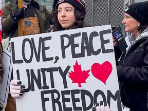 A supporter takes part in the continuing truckers' protest against mandated vaccinations, in Ottawa on Feb. 2, 2022.