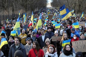 People march during an anti-war protest, after Russia launched a massive military operation against Ukraine, in Warsaw, Poland, February 27, 2022. Kuba Atys/Agencja Wyborcza.pl via Reuters