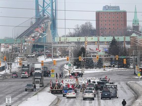 In this Feb. 8 photo, anti-mandate protesters blockade one of the access roads to the Ambassador Bridge connecting Ontario with Michigan.