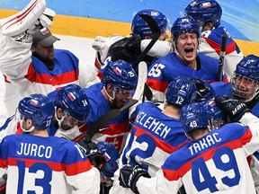 Slovakia's players celebrate victory during the men's playoff quarterfinal match of the Beijing 2022 Winter Olympic Games.