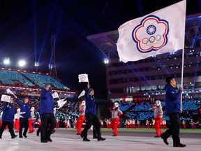 FILE PHOTO: Pyeongchang 2018 Winter Olympics – Opening ceremony – Pyeongchang Olympic Stadium - Pyeongchang, South Korea – February 9, 2018 -  Te-An Lien of Taiwan carries the national flag during the opening ceremony.