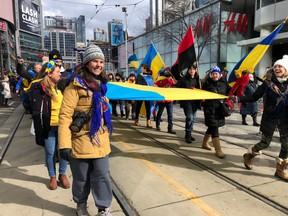 Demonstrators march in Toronto on Sunday, February 27th in solidarity with Ukraine.