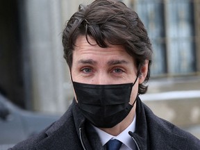 Prime Minister Justin Trudeau walks back to his office after attending a news conference on Feb.  21, 2022, in Ottawa.