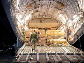 Canada's military aid is unloaded from a C17 Globemaster III plane at the International Airport outside Lviv, in this handout picture released February 20, 2022. Press service of the Ukrainian Armed Forces General Staff.