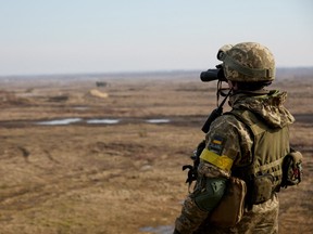 A service member of the Ukrainian armed forces takes part in tactical military exercises in Ukraine on Feb. 16, 2022.
