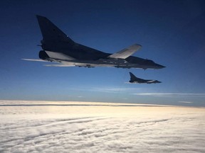 Two Russian long-range strategic bombers Tu-22M3 perform joint military exercises with Belarusian Air Forces in Belarusian air space on Feb. 5, 2022.