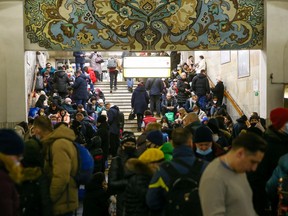 People take shelter in a subway station, after Russian President Vladimir Putin authorized a military operation in eastern Ukraine, in Kyiv, Ukraine February 24, 2022. Kyiv Mayor Vitaly Klitschko declared a curfew from 10 p.m. until 7 a.m., saying transport would be halted overnight and subway stations used as round-the-clock shelters because of "conditions of military aggression."