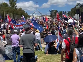 An image captured by Australian Senator Malcolm Roberts showing a massive anti-mandate demonstration outside the Parliament of Australia in Canberra on Friday. Protesters took inspiration from Freedom Convoy protesters in Ottawa, including the flying of upside-down national flags, a traditional signal of distress.