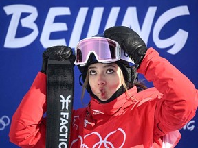 China's Eileen Gu waits to see her score as she competes in the freestyle skiing women's freeski slopestyle final run during the Beijing 2022 Winter Olympic Games.