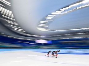 From L: Canada's Ivanie Blondin, Canada's Valerie Maltais and Canada's Isabelle Weidemann compete in the women's speed skating team pursuit semifinal during the Beijing 2022 Winter Olympic Games at the National Speed Skating Oval in Beijing on February 15, 2022. (Photo by WANG Zhao / AFP)