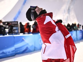 Canada's Max Parrot reacts after winning the snowboard men's slopestyle final run during the Beijing 2022 Winter Olympic Games.