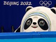 Beijing 2022 Winter Olympic mascot Bing Dwen Dwen peeks over the edge of the barrier around the short track speed skating venue before a series of races on Monday, February 7, 2022. 

Gavin Young/Postmedia