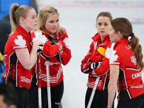 Team Canada's women's curling team from left;  Dawn McEwen, Jennifer Jones, Jocelyn Peterman and Kaitlyn Lawes talk during their game against Japan at the Beijing 2022 Winter Olympics on Friday, February 11, 2022. 

Gavin Young/Postmedia