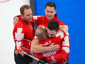 Team Canada celebrates after defeating the USA to win the bronze medal in men's curling at the Beijing 2022 Winter Olympics on Friday, February 18, 2022. 

Gavin Young/Postmedia