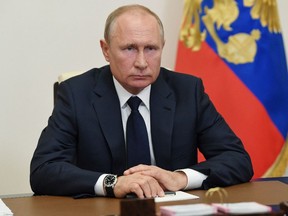 Russian President Vladimir Putin delivers a televised address to the nation in May 2020.