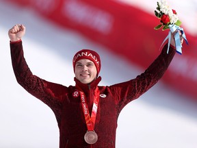 Bronze medalist James Crawford of Team Canada poses during the Men's Alpine Combined medal ceremony on day six of the Beijing 2022 Winter Olympic Games.