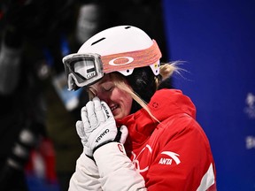 Canada's Justine Dufour-Lapointe reacts after her run in the freestyle skiing women's moguls final during the Beijing 2022 Winter Olympic Games.