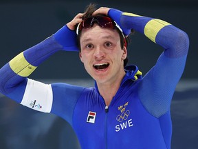Nils van der Poel of Team Sweden celebrates winning the Gold Medal and setting a new Olympic record time of 6:08.84 during the Men's 5000m on day two of the Beijing 2022 Winter Olympic Games.