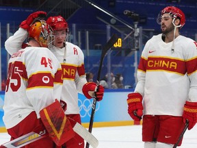 China players look dejected after the match.