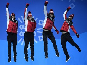 Bronze medalists Samuel Girard, Charles Hamelin, Charle Cournoyer and Pascal Dion of Canada celebrate during the medal ceremony for Short Track Speed Skating - Men's 5,000m Relay on day 14 of the PyeongChang 2018 Winter Olympic Games.
