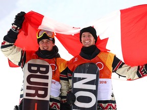 Bronze medalist Mark McMorris of Canada and silver medalist Max Parrot of Canada pose during the victory ceremony for the Snowboard Men's Slopestyle Final at the PyeongChang 2018 Winter Olympic Games.