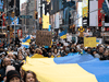 People take part in a protest against Russia’s invasion of Ukraine, in Times Square, New York City, February 24, 2022.