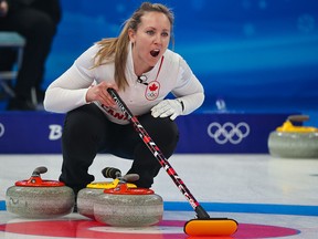 Rachel Homan shouts out a call while competing with John Morris in Olympic mixed doubles curling against Great Britain at the 2022 Winter Olympics.