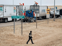 Trucks form part of a blockade at an anti-COVID vaccine mandate protest at the U.S. border crossing in Coutts, Alberta., Jan. 31, 2022.
