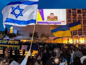 Why Israel — a desert country surrounded by enemies — is outperforming other countries - Breaking News Demonstrators gather at Habima Square in the centre of Israel’s Mediterranean coastal city of Tel Aviv on March 20, 2022 to attend a televised video address by Ukraine’s President Volodymyr Zelensky.