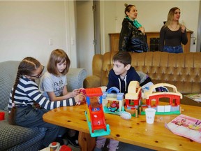 Ukrainian children who have fled their homeland are seen playing at a centre in Denmark. In Quebec, refugee children — even those with a knowledge of English — will have to attend French schools, says the CAQ government.