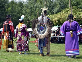 Dancers in traditional regalia pictured at the Saugeen First Nation powwow in 2018. While CIBC doesn't ask its Irish applicants to riverdance for a job, they have been criticized for a new hiring policy that asks Indigenous applicants to submit videos of themselves in traditional regalia.