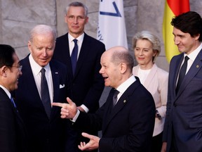 Prime Minister Justin Trudeau stands at the edge of a clutch of world leaders at the G7 summit in Brussels. They are: Japan's Prime Minister Fumio Kishida, U.S. President Joe Biden and Germany's Chancellor Olaf Scholz, NATO Secretary General Jens Stoltenberg and European Commission President Ursula von der Leyen.
